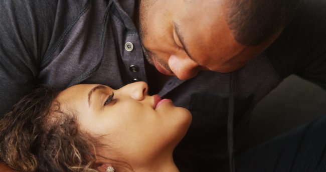 Adobestock Closeup of African boyfriend kissing his girlfriend