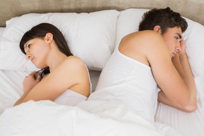 Dollar Photo Couple sleeping back to back after an argument