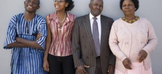 Ties with family Dollar Photo - Happy African Family