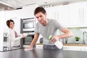Young Couple Cleaning Cleaning Kitchen -Dollarphotoclub_23438396.jpg